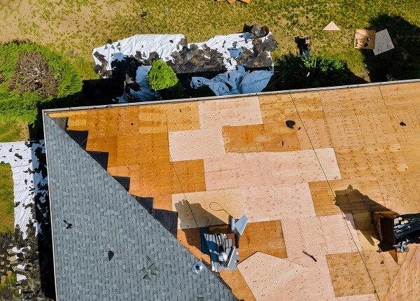 roof repair on a damaged home in hendry county