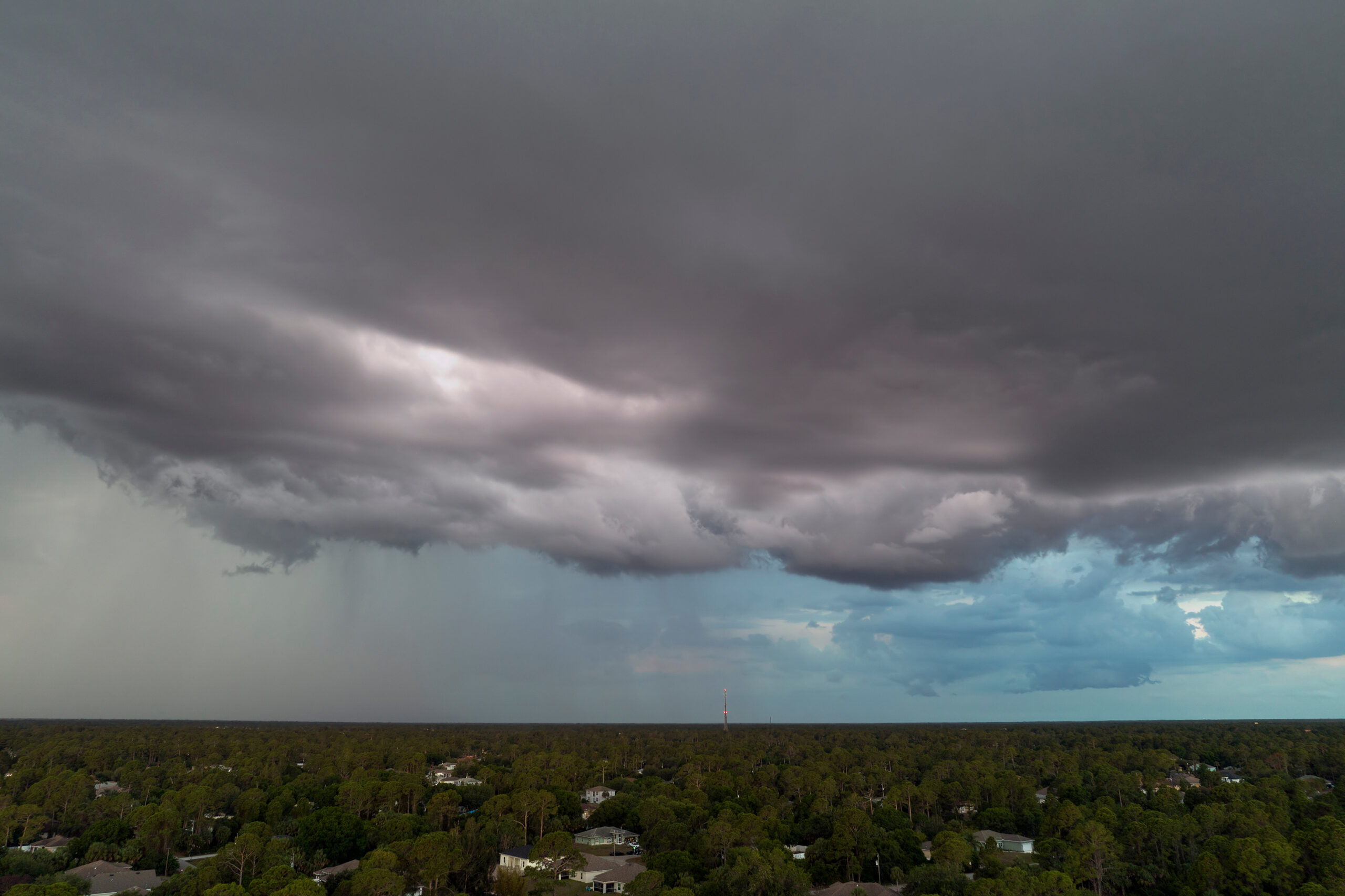Ominous storm clouds gather over a Florida town.